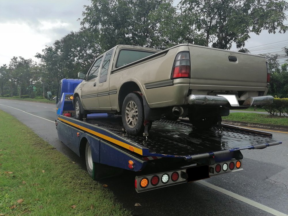 car-has-broken-down-being-pulled-up-into-tow-truck